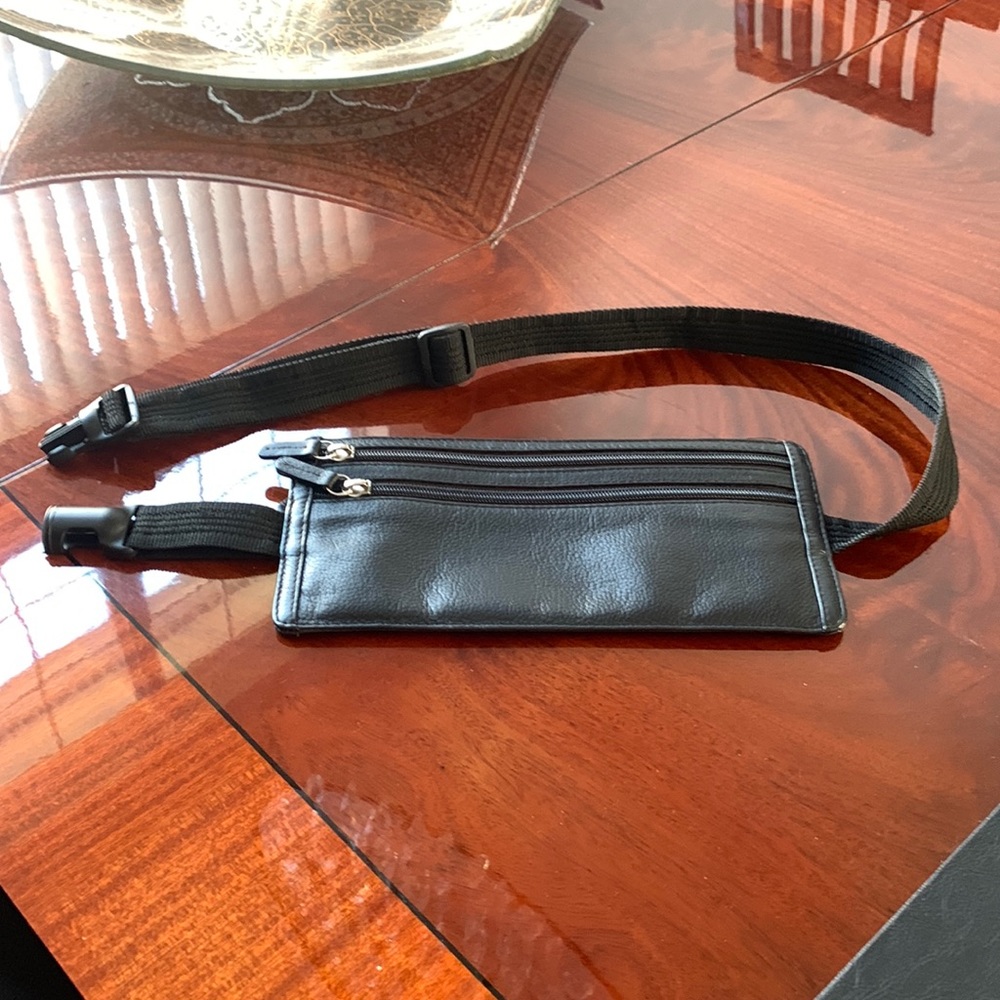 NWOT Genuine lather Fanny pack. 3 compartments on zipper. Adjustable strap.